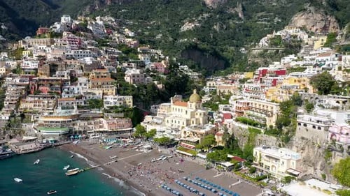 Aerial view of Positano with comfortable beach and blue sea on Amalfi Coast in Campania, Italy. Posi