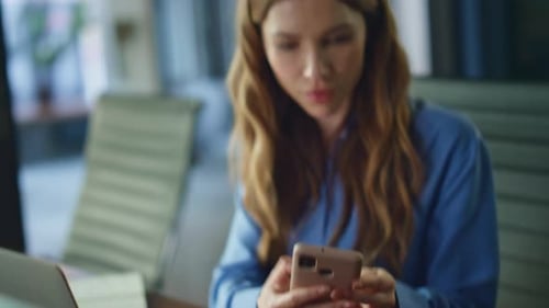 Emotional Businesswoman Reacting Mobile Phone Message at Office Interior Closeup