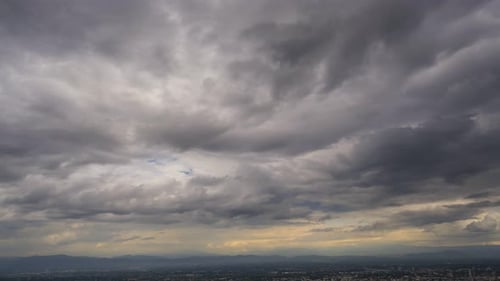 Time lapse of Dark storm clouds over town.