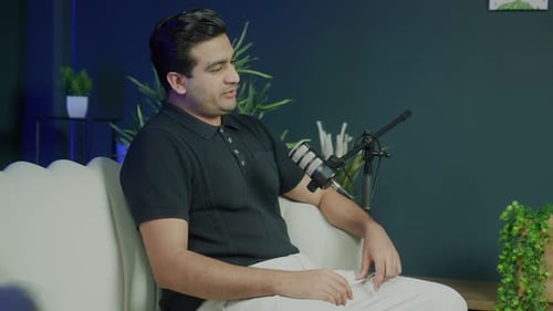 Podcast Host Listening and Laughing During Interview