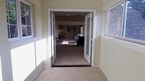 Stabilized shot of hallway inside luxury home.