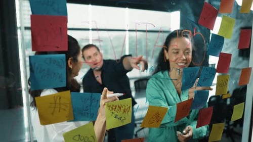 Team Brainstorming Ideas Together in Modern Office