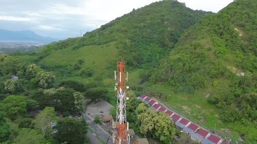 aerial view of cellular antenna, Communication Building Antenna with a backdrop of mountains and sky
