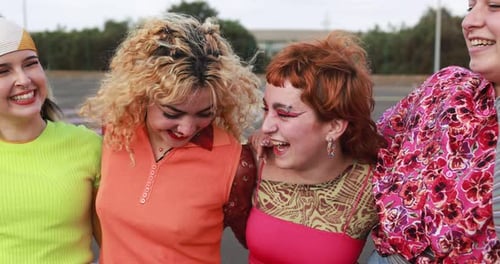 Group of Friends Laughing Together in Urban Setting