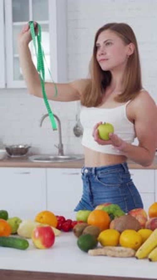 Woman Holding Measuring Tape and Healthy Food