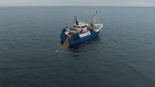 Fishing Boat Hauling Nets in Open Ocean