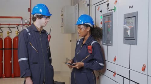 Engineers Discussing Industrial Systems in Workplace