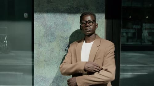 Outdoor Portrait of Serious African American Manager Crossing Arms