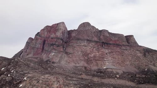 Exploring The Ancient Crimson Peaks And Rugged Terrain Of The Great Red Mountain