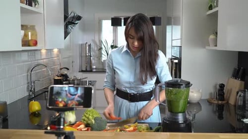 Woman Prepares Healthy Meal in Bright Kitchen