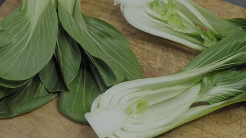 Endives on a wooden cutting board (Cichorium intybus). Fresh chicories