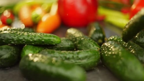 A Ripe Green Cucumber Falls and Splits in Half