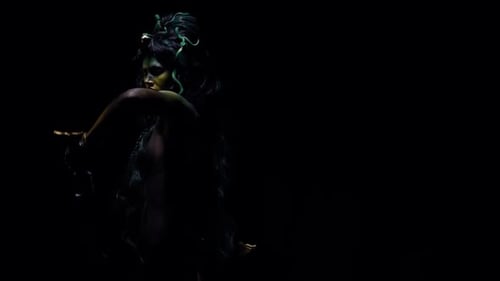 Woman with Sword and Body Paint in Darkness