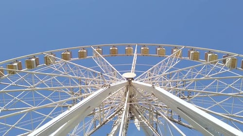 White Big wheel spinning at an Amusement park.