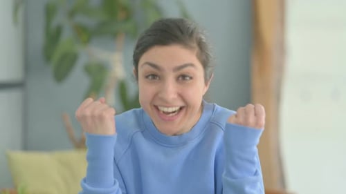 Excited Indian Woman Celebrating Success, Feeling Happy
