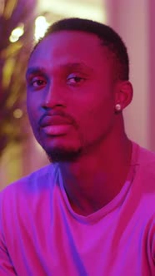 Adult Man Portrait Close Up with Pink Lighting