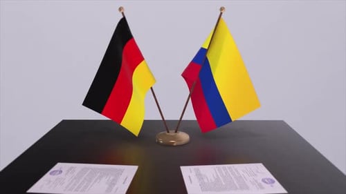 Flags of Germany and Columbia on a desk