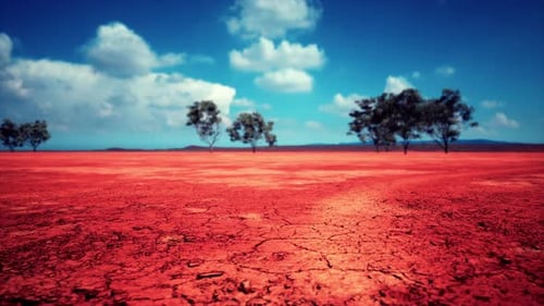Aerial Flight Over Dry Cracked Red Earth Landscape