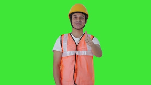 Happy Indian construction labour showing thumbs up Green screen