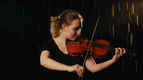 Violinist Plays Beautiful Music in Dark Room