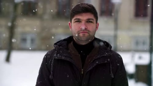 Man Standing in the Snow, Warming Hands