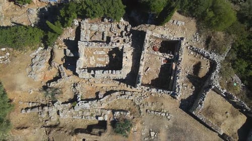 Ascending top shot of an archeological excavation site with the ancient ruins that used to be the pa