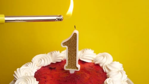 Lighting Number One Candle on Birthday Cake