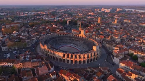 Aerial sweep of Arles with Rhone river and sunlit skyline