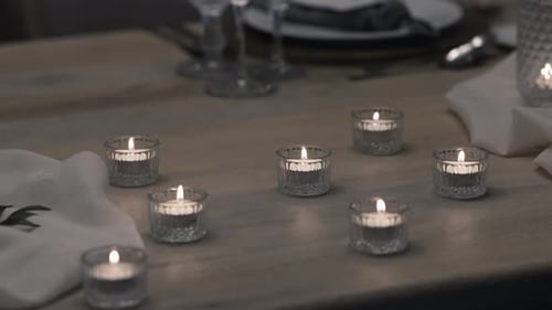 Elegant Table Setting with Glowing Candles