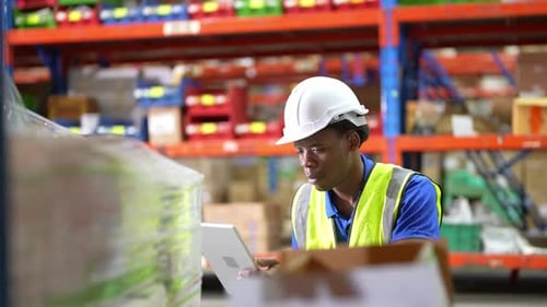 Worker Doing Inventory in Warehouse. Dispatcher in uniform making inventory in storehouse. supply ch