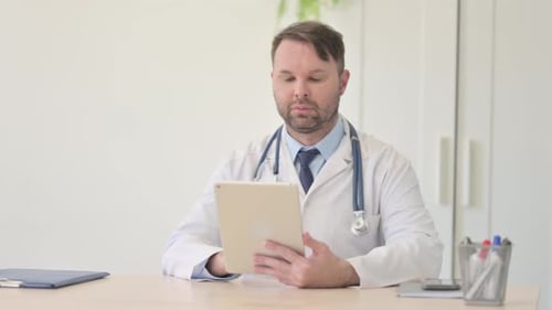 Doctor Uses Tablet for Healthcare in Office