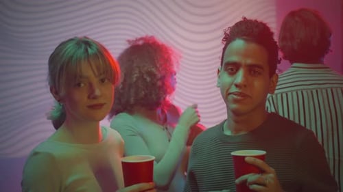 Multiracial Couple Dancing at Party in Night Club