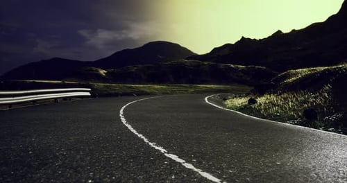 Winding Road Under a Stunning Twilight Sky in a Mountainous Landscape