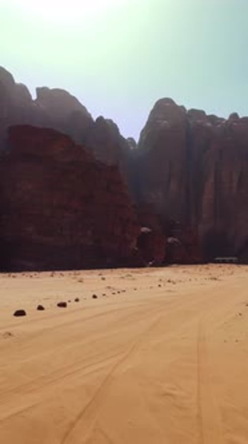 A Stunningly Beautiful Desert Landscape Featuring Radiant Sunlight and a Majestic Mountain Backdrop