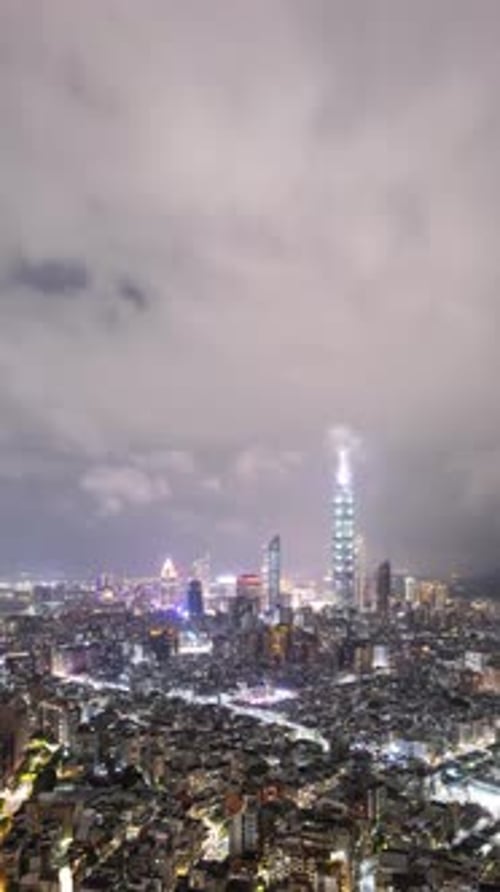 Time Lapse of low clouds above Taipei Taiwan at night Vertical Video.