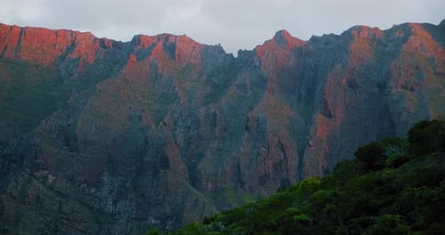 Mountain ranges ridge at sunset light. Orange down. Masca gorge, spectacular rocks landscape. Teneri