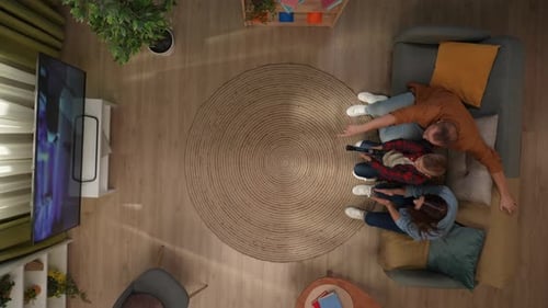 Top View of Room Mother Father and Son Sitting on the Sofa Kid Playing Video Game Parents Helping