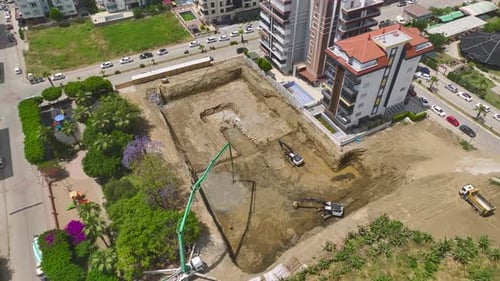 Aerial View Building Kickoff First Concrete and Machinery on Site