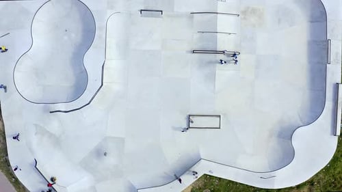 People skateboarding at a skatepark