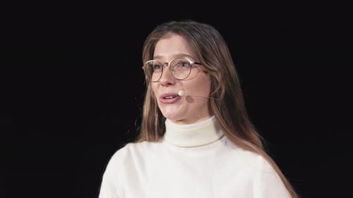 Woman Explaining at Technology Conference