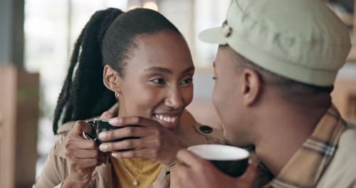 Couple, coffee and romantic with kiss at restaurant, cafe or diner for bond, care or love