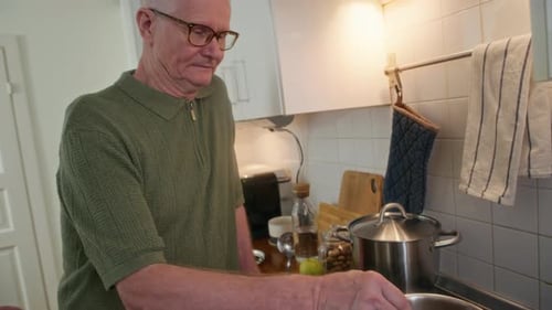 Senior Couple Cooking Together in Bright Kitchen