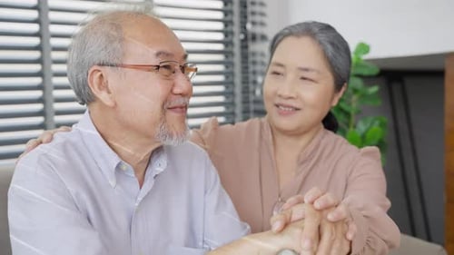 Loving Senior Couple Enjoying Quiet Time at Home