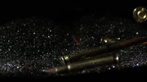 Firearms Cartridge Of 300 AAC Blackout Over Gunpowder. Close Up Shot