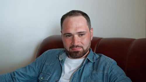Man Sitting on Couch Close-Up Portrait