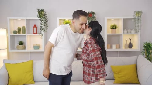 Loving Couple Embracing Affectionately in Bright Home