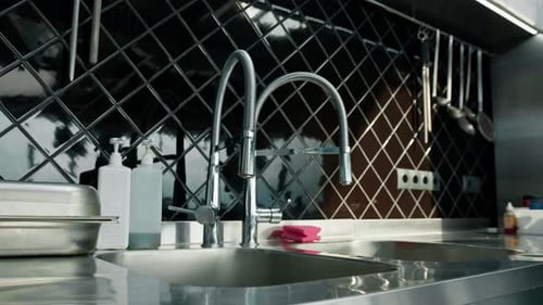 Professional commercial empty clean modern kitchen in restaurant or cafe Metal kitchen equipment