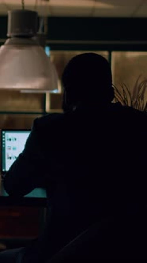 Vertical Video Employee Alone Overnight in Office