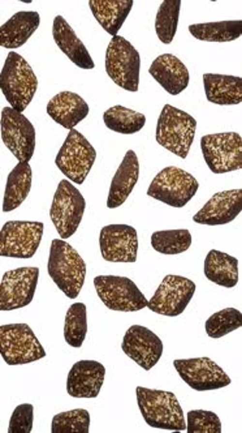 Vertical Falling Black Seed Breads on White