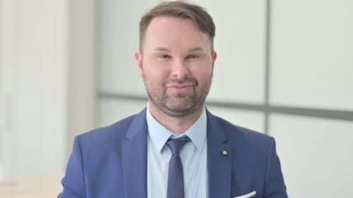Smiling Man in Suit Close Up in Office